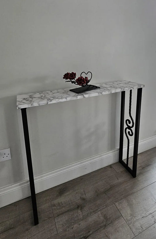 Front view of a console table with decorative black scroll legs